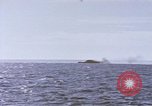 Image of USS Cod fires deck gun in actions to scuttle Dutch submarine, O-19 Spratly Islands, 1945, second 22 stock footage video 65675076091