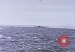 Image of USS Cod fires deck gun in actions to scuttle Dutch submarine, O-19 Spratly Islands, 1945, second 23 stock footage video 65675076091