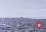 Image of USS Cod fires deck gun in actions to scuttle Dutch submarine, O-19 Spratly Islands, 1945, second 24 stock footage video 65675076091