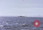 Image of USS Cod fires deck gun in actions to scuttle Dutch submarine, O-19 Spratly Islands, 1945, second 25 stock footage video 65675076091
