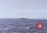Image of USS Cod fires deck gun in actions to scuttle Dutch submarine, O-19 Spratly Islands, 1945, second 26 stock footage video 65675076091