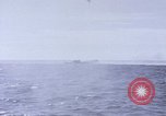 Image of USS Cod fires deck gun in actions to scuttle Dutch submarine, O-19 Spratly Islands, 1945, second 28 stock footage video 65675076091