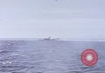 Image of USS Cod fires deck gun in actions to scuttle Dutch submarine, O-19 Spratly Islands, 1945, second 29 stock footage video 65675076091
