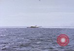 Image of USS Cod fires deck gun in actions to scuttle Dutch submarine, O-19 Spratly Islands, 1945, second 30 stock footage video 65675076091