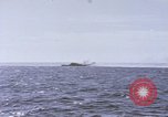 Image of USS Cod fires deck gun in actions to scuttle Dutch submarine, O-19 Spratly Islands, 1945, second 31 stock footage video 65675076091