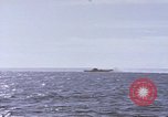 Image of USS Cod fires deck gun in actions to scuttle Dutch submarine, O-19 Spratly Islands, 1945, second 32 stock footage video 65675076091