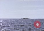 Image of USS Cod fires deck gun in actions to scuttle Dutch submarine, O-19 Spratly Islands, 1945, second 33 stock footage video 65675076091