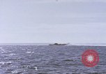 Image of USS Cod fires deck gun in actions to scuttle Dutch submarine, O-19 Spratly Islands, 1945, second 34 stock footage video 65675076091