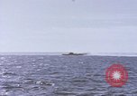 Image of USS Cod fires deck gun in actions to scuttle Dutch submarine, O-19 Spratly Islands, 1945, second 35 stock footage video 65675076091