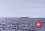 Image of USS Cod fires deck gun in actions to scuttle Dutch submarine, O-19 Spratly Islands, 1945, second 36 stock footage video 65675076091