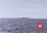 Image of USS Cod fires deck gun in actions to scuttle Dutch submarine, O-19 Spratly Islands, 1945, second 37 stock footage video 65675076091
