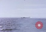 Image of USS Cod fires deck gun in actions to scuttle Dutch submarine, O-19 Spratly Islands, 1945, second 38 stock footage video 65675076091