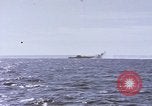 Image of USS Cod fires deck gun in actions to scuttle Dutch submarine, O-19 Spratly Islands, 1945, second 40 stock footage video 65675076091