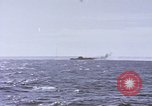 Image of USS Cod fires deck gun in actions to scuttle Dutch submarine, O-19 Spratly Islands, 1945, second 41 stock footage video 65675076091