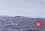 Image of USS Cod fires deck gun in actions to scuttle Dutch submarine, O-19 Spratly Islands, 1945, second 43 stock footage video 65675076091