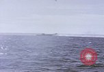 Image of USS Cod fires deck gun in actions to scuttle Dutch submarine, O-19 Spratly Islands, 1945, second 44 stock footage video 65675076091