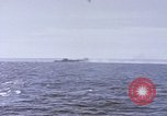 Image of USS Cod fires deck gun in actions to scuttle Dutch submarine, O-19 Spratly Islands, 1945, second 45 stock footage video 65675076091