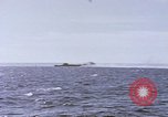 Image of USS Cod fires deck gun in actions to scuttle Dutch submarine, O-19 Spratly Islands, 1945, second 47 stock footage video 65675076091