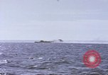 Image of USS Cod fires deck gun in actions to scuttle Dutch submarine, O-19 Spratly Islands, 1945, second 48 stock footage video 65675076091