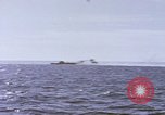 Image of USS Cod fires deck gun in actions to scuttle Dutch submarine, O-19 Spratly Islands, 1945, second 49 stock footage video 65675076091
