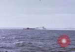 Image of USS Cod fires deck gun in actions to scuttle Dutch submarine, O-19 Spratly Islands, 1945, second 50 stock footage video 65675076091
