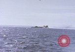Image of USS Cod fires deck gun in actions to scuttle Dutch submarine, O-19 Spratly Islands, 1945, second 52 stock footage video 65675076091