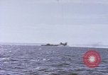 Image of USS Cod fires deck gun in actions to scuttle Dutch submarine, O-19 Spratly Islands, 1945, second 53 stock footage video 65675076091