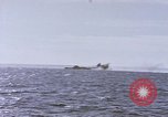 Image of USS Cod fires deck gun in actions to scuttle Dutch submarine, O-19 Spratly Islands, 1945, second 54 stock footage video 65675076091