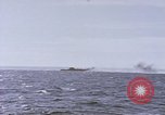 Image of USS Cod fires deck gun in actions to scuttle Dutch submarine, O-19 Spratly Islands, 1945, second 55 stock footage video 65675076091