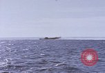 Image of USS Cod fires deck gun in actions to scuttle Dutch submarine, O-19 Spratly Islands, 1945, second 59 stock footage video 65675076091