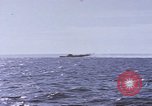 Image of USS Cod fires deck gun in actions to scuttle Dutch submarine, O-19 Spratly Islands, 1945, second 60 stock footage video 65675076091