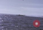 Image of USS Cod fires deck gun in actions to scuttle Dutch submarine, O-19 Spratly Islands, 1945, second 61 stock footage video 65675076091