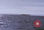 Image of USS Cod fires deck gun in actions to scuttle Dutch submarine, O-19 Spratly Islands, 1945, second 62 stock footage video 65675076091