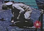 Image of USS Sea Owl arriving in port with Japanese prisoners of war Hawaii USA, 1945, second 41 stock footage video 65675076110
