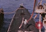 Image of US Sailors decorate their submarine on VJ Day in Pearl Harbor Hawaii USA, 1945, second 15 stock footage video 65675076118