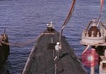 Image of US Sailors decorate their submarine on VJ Day in Pearl Harbor Hawaii USA, 1945, second 20 stock footage video 65675076118