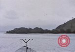 Image of American submarine waits in bay for commandos Pacific Theater, 1944, second 4 stock footage video 65675076122