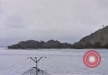 Image of American submarine waits in bay for commandos Pacific Theater, 1944, second 5 stock footage video 65675076122