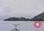 Image of American submarine waits in bay for commandos Pacific Theater, 1944, second 10 stock footage video 65675076122