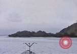 Image of American submarine waits in bay for commandos Pacific Theater, 1944, second 13 stock footage video 65675076122