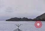 Image of American submarine waits in bay for commandos Pacific Theater, 1944, second 15 stock footage video 65675076122
