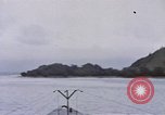 Image of American submarine waits in bay for commandos Pacific Theater, 1944, second 16 stock footage video 65675076122