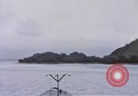 Image of American submarine waits in bay for commandos Pacific Theater, 1944, second 18 stock footage video 65675076122