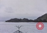 Image of American submarine waits in bay for commandos Pacific Theater, 1944, second 19 stock footage video 65675076122