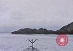 Image of American submarine waits in bay for commandos Pacific Theater, 1944, second 21 stock footage video 65675076122