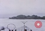 Image of American submarine waits in bay for commandos Pacific Theater, 1944, second 22 stock footage video 65675076122