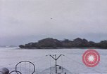 Image of American submarine waits in bay for commandos Pacific Theater, 1944, second 26 stock footage video 65675076122