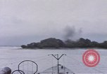 Image of American submarine waits in bay for commandos Pacific Theater, 1944, second 43 stock footage video 65675076122