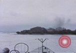 Image of American submarine waits in bay for commandos Pacific Theater, 1944, second 49 stock footage video 65675076122