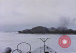 Image of American submarine waits in bay for commandos Pacific Theater, 1944, second 51 stock footage video 65675076122